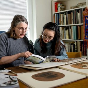 Student talking to professor