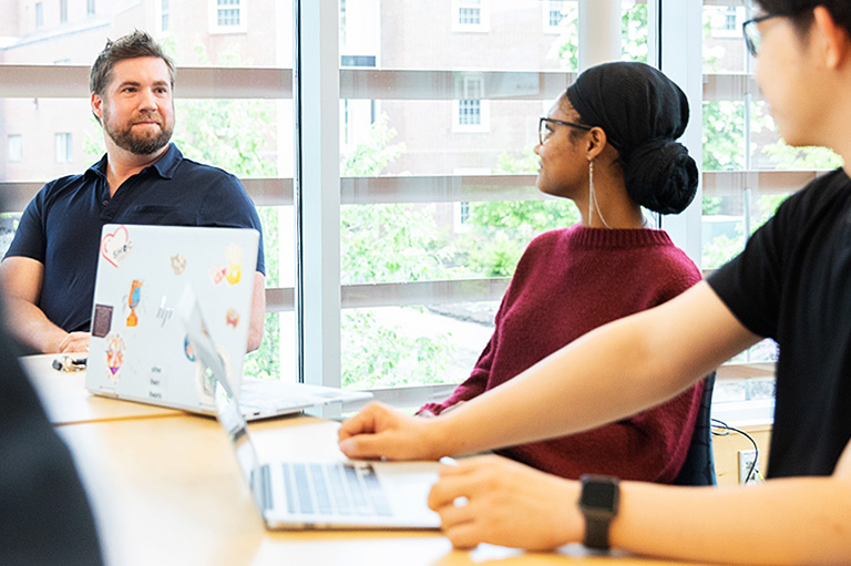 Students meeting with advisor