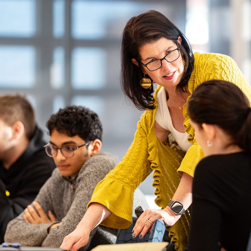 Woman talking to student